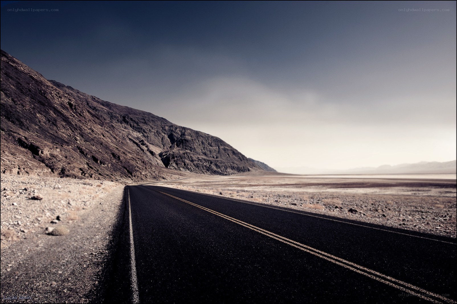 Desert road stretching into horizon