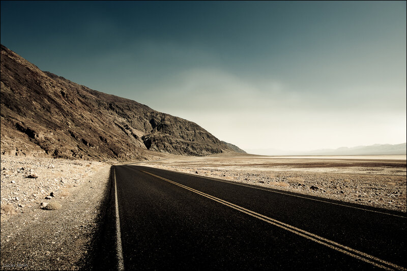 Desert road stretching into horizon