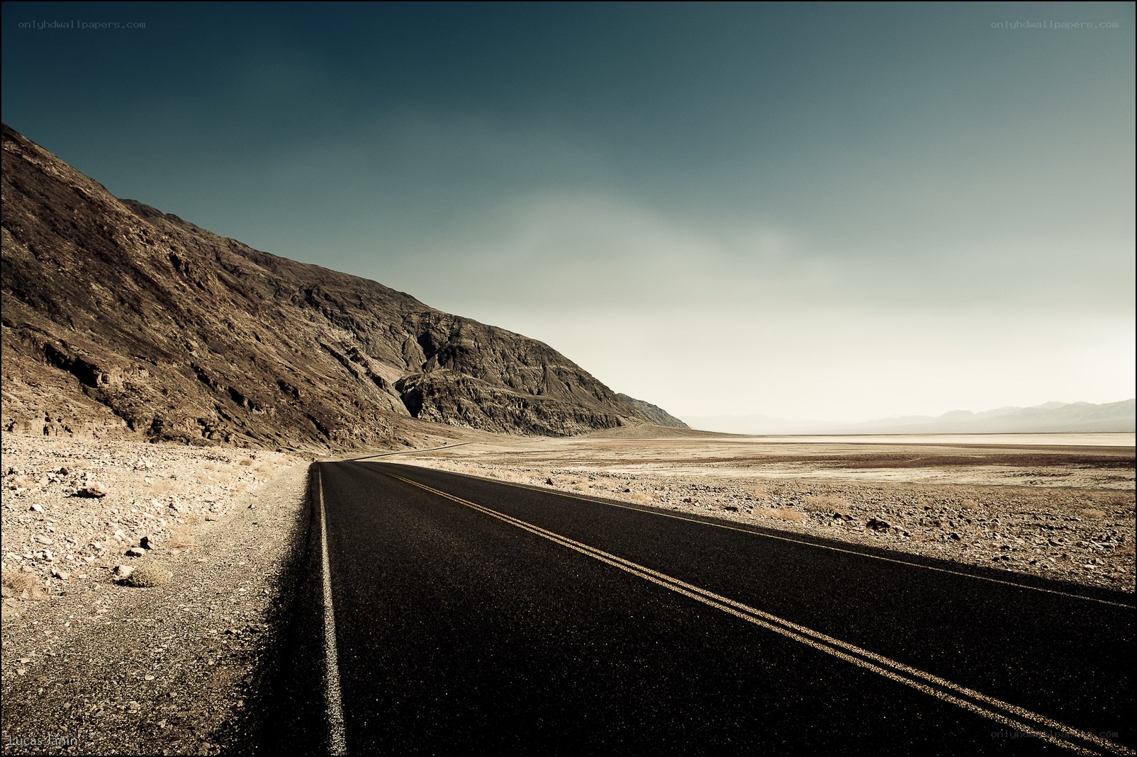 Desert road stretching into horizon