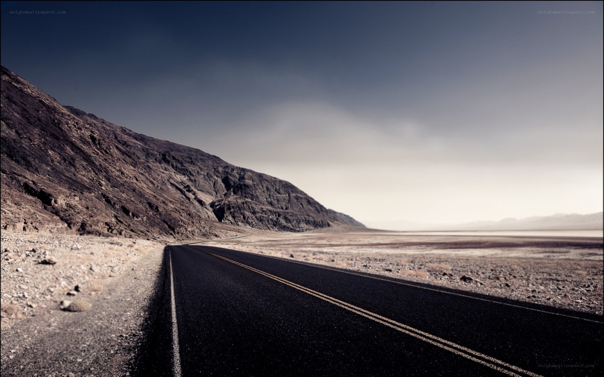 Desert road stretching into horizon