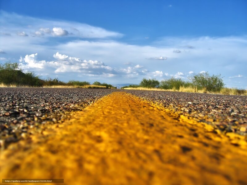 Desert road under blue sky