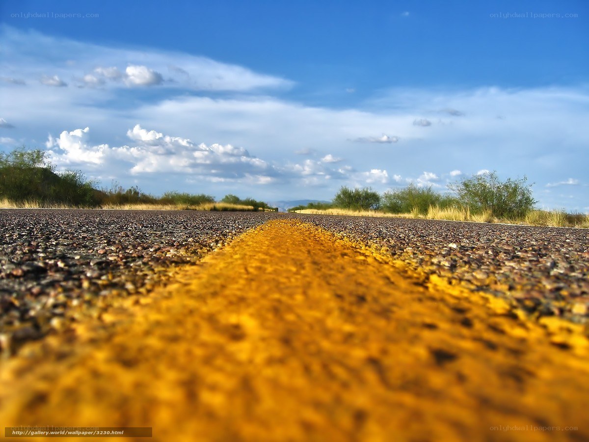 Desert road under blue sky