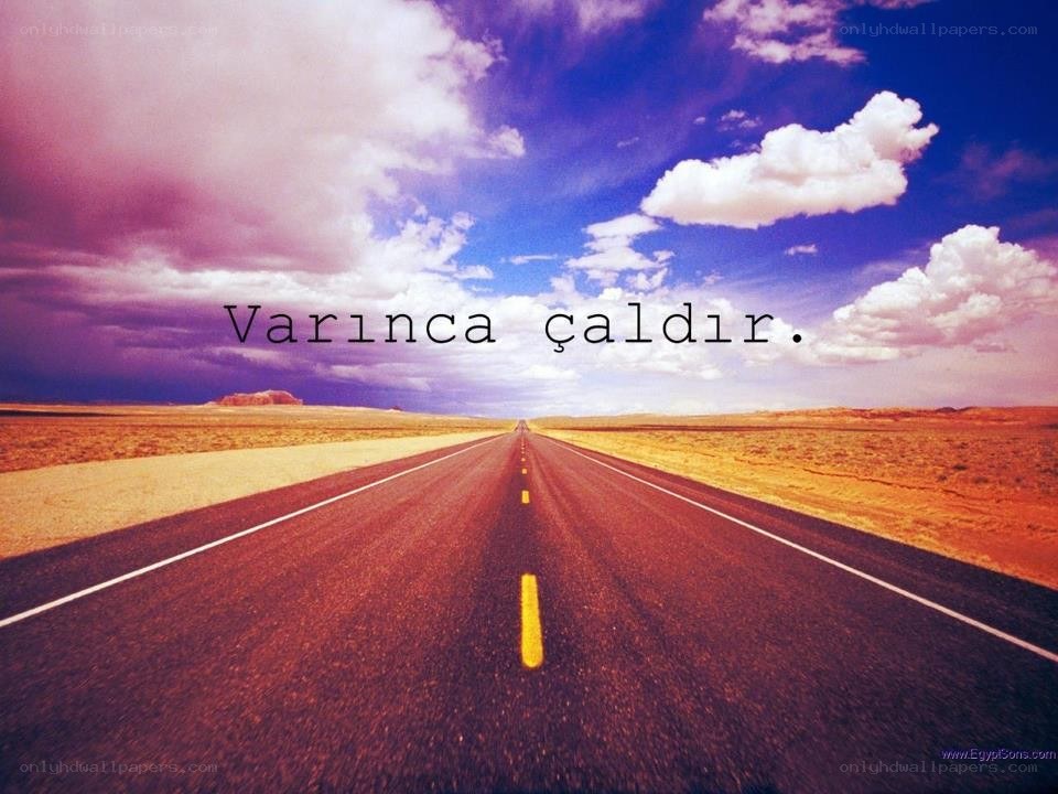 Desert road under colorful sky