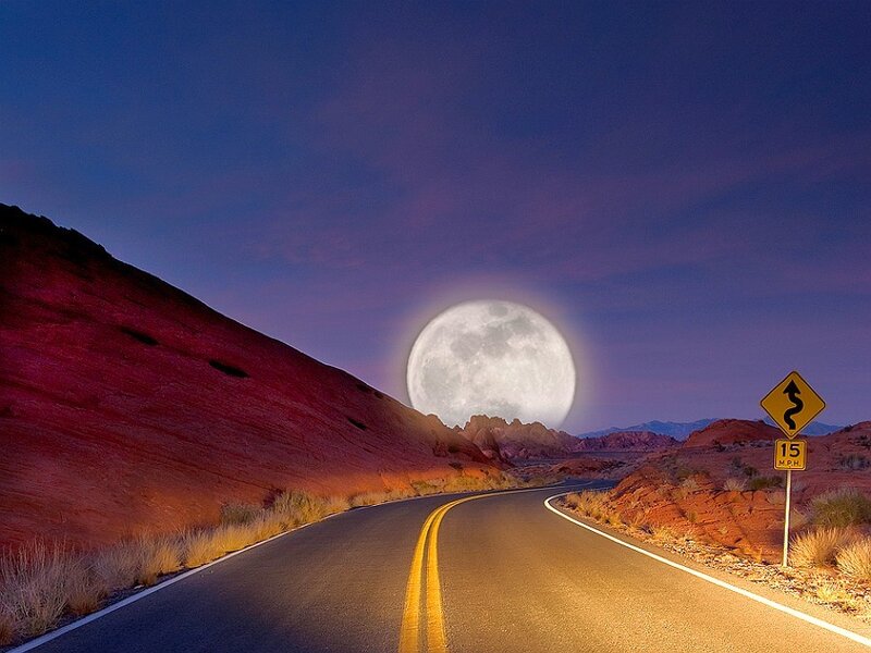 Desert road under full moon