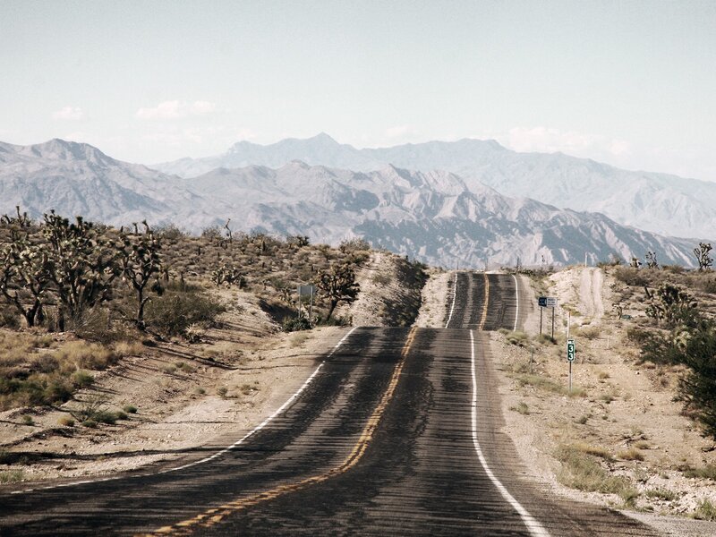 Desert road with mountains