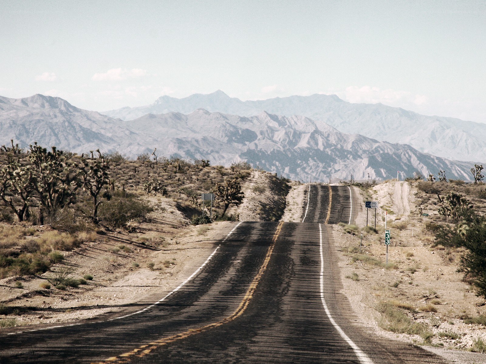 Desert road with mountains