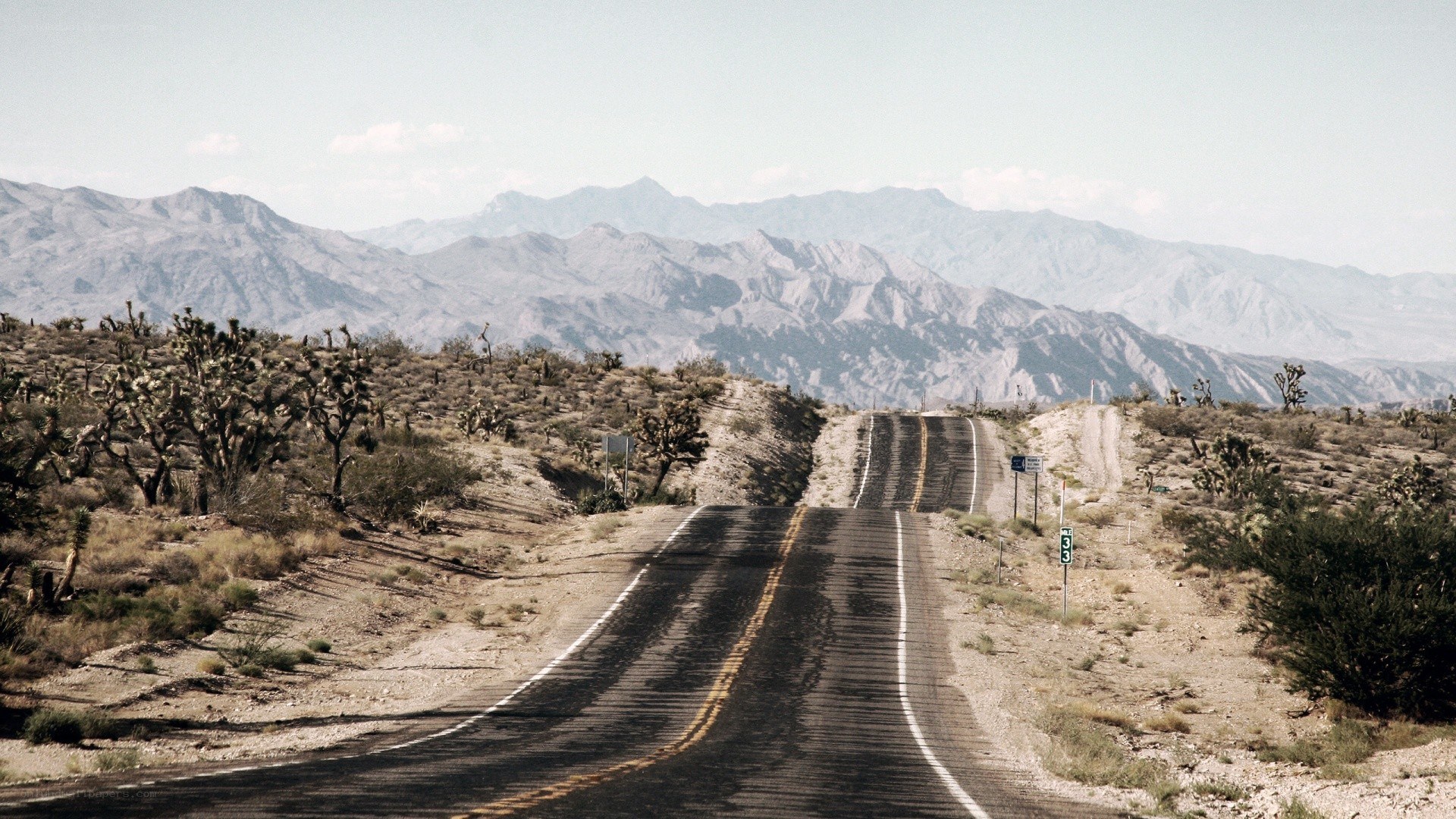 Desert road with mountains