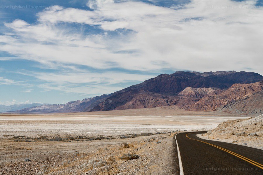 Desert road with mountains