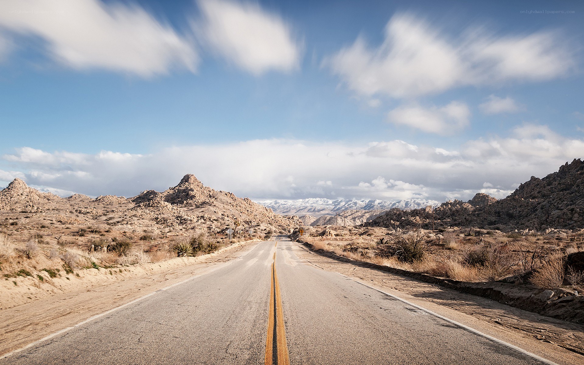 Desert road with mountains