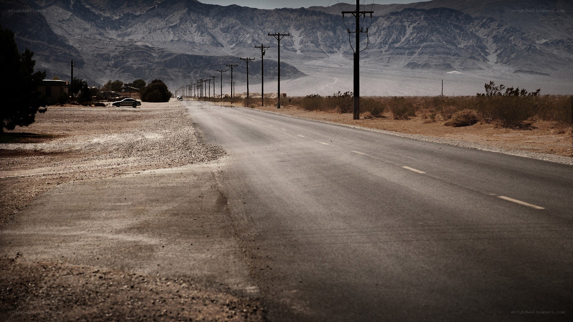 Desert road with mountains