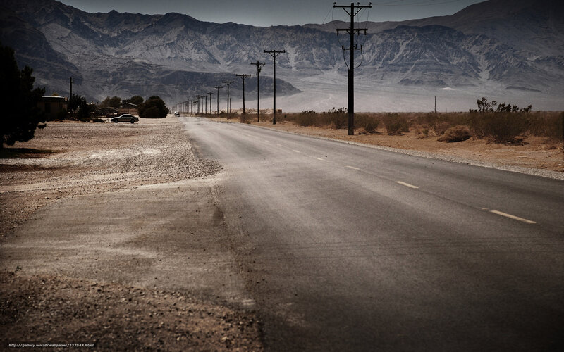 Desert road with mountains