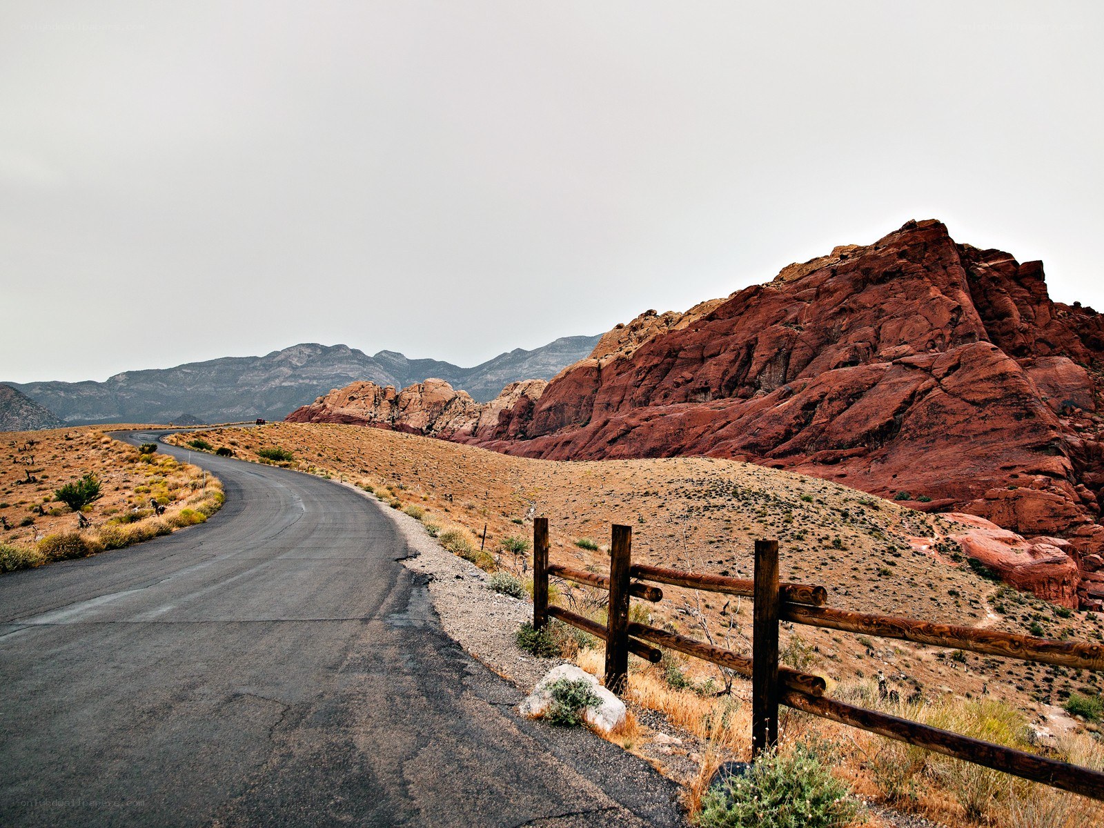 Desert road with red rock formations