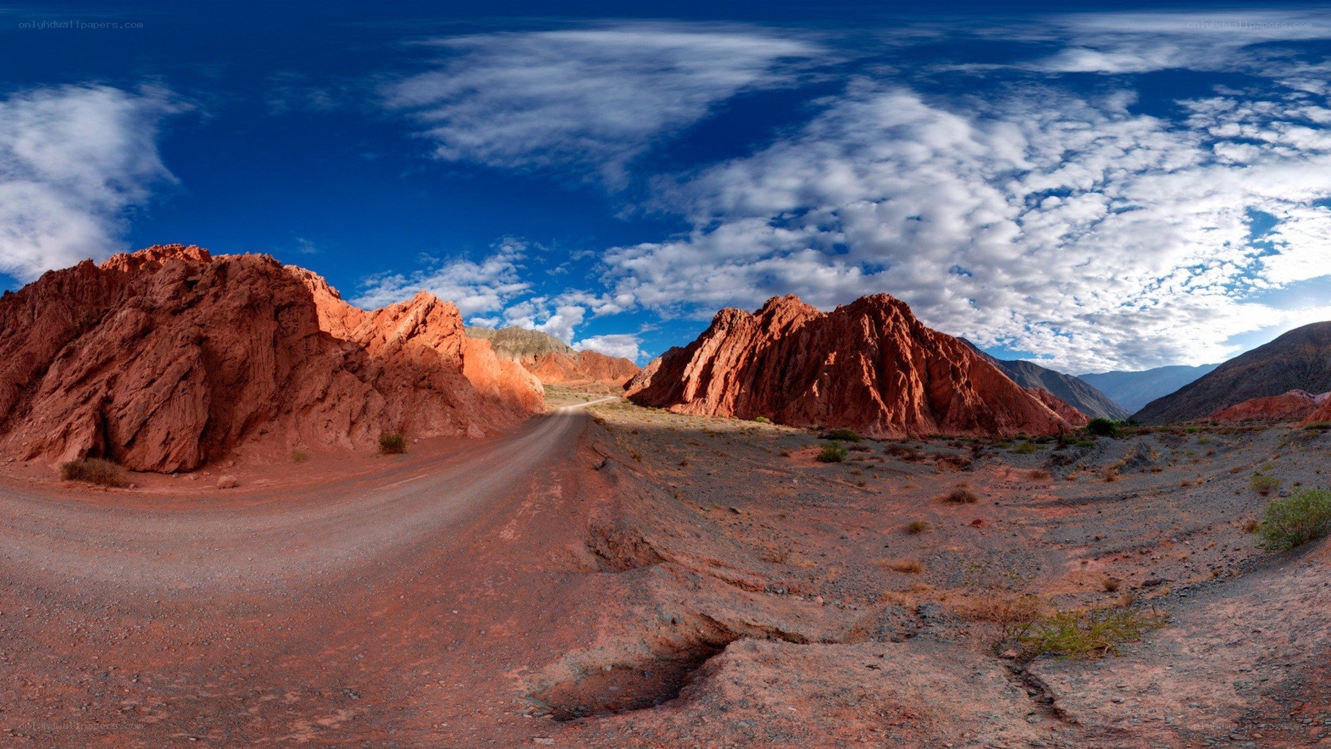 Desert road with red rock formations