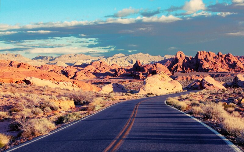 Desert road with red rock formations