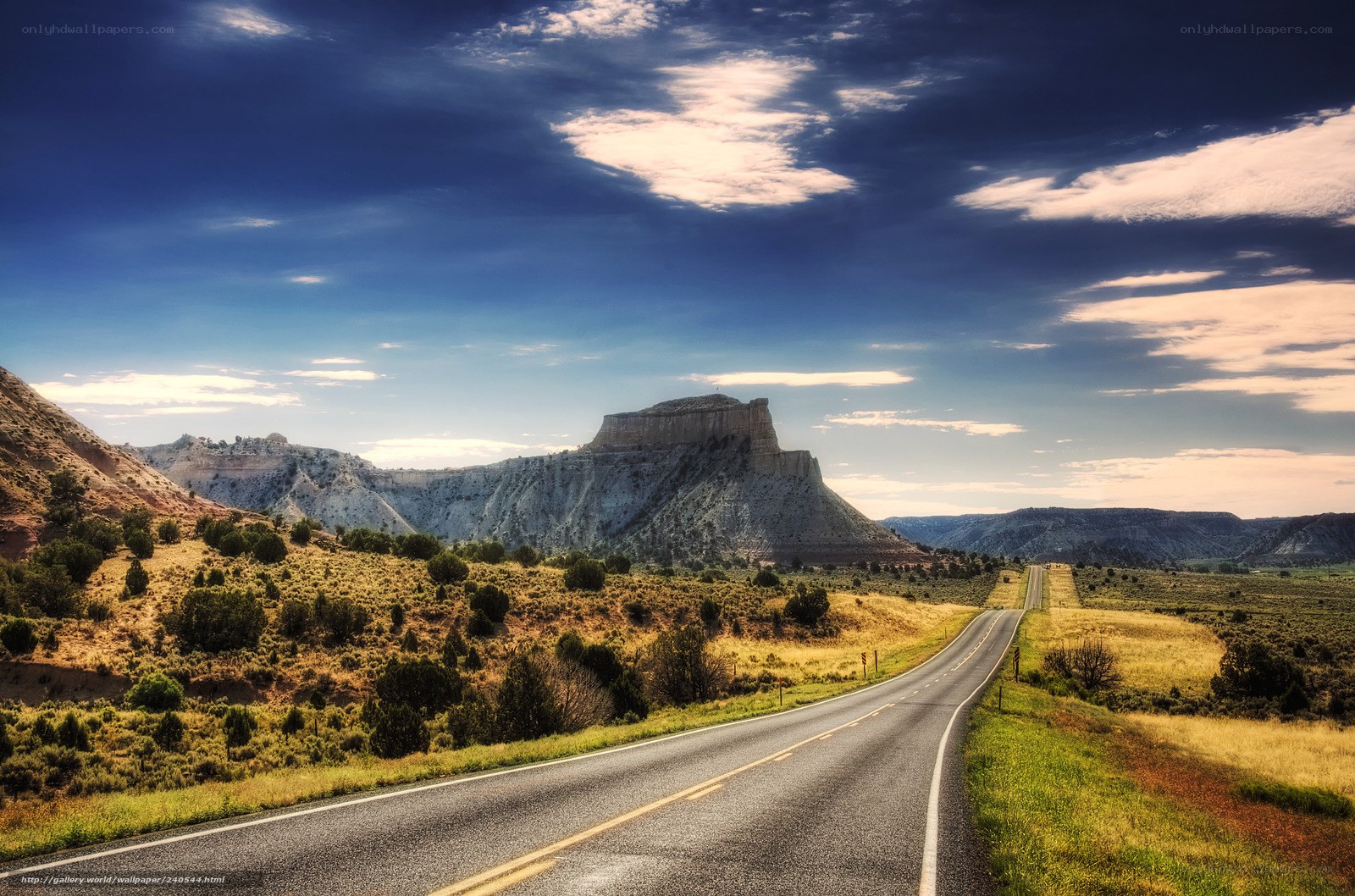 Desert road with rock formation