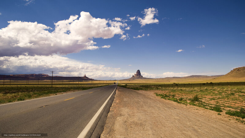 Desert road with rock formation