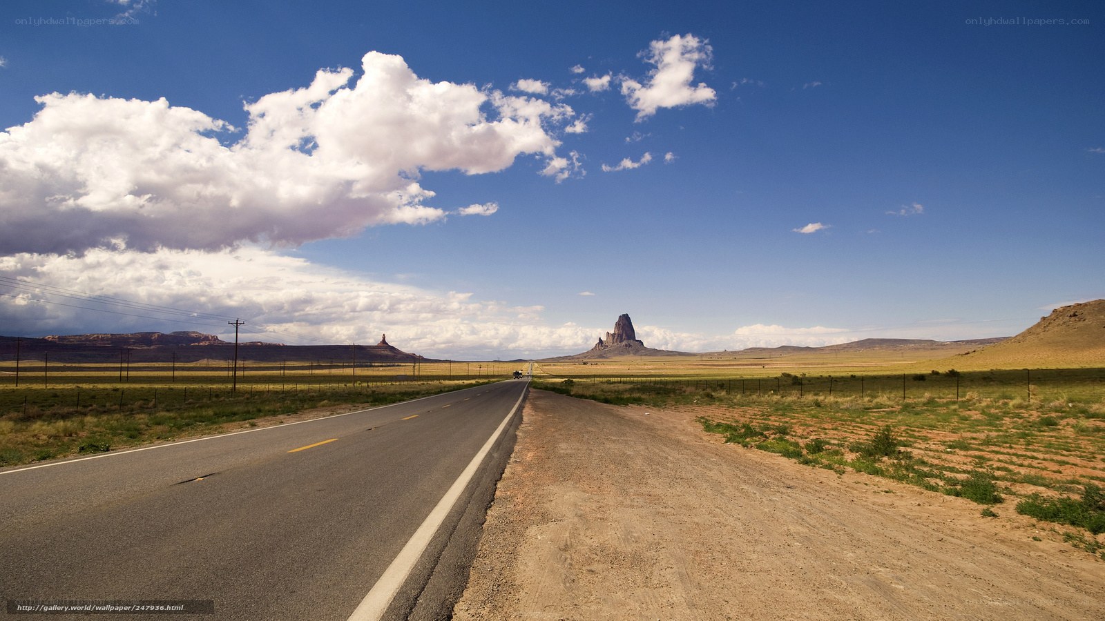 Desert road with rock formation