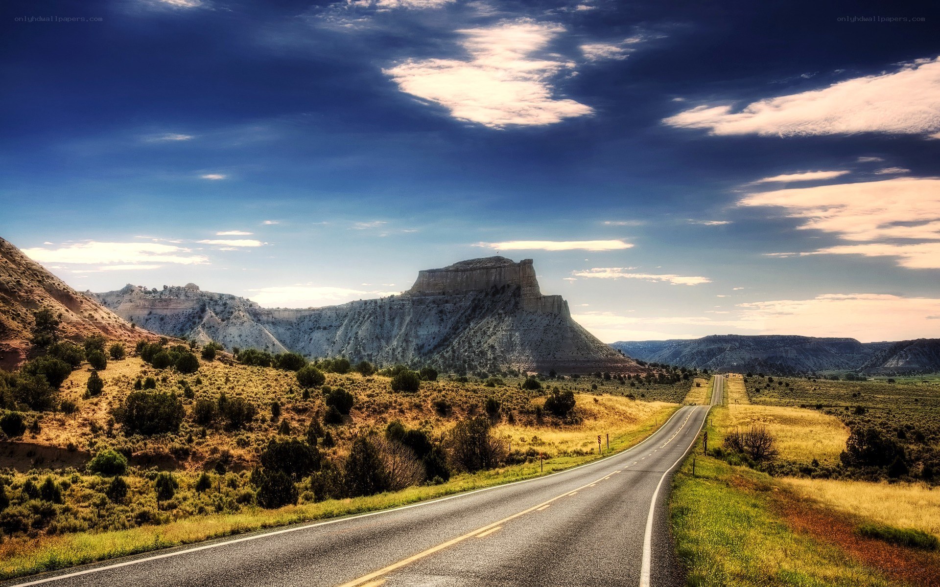 Desert road with rock formation