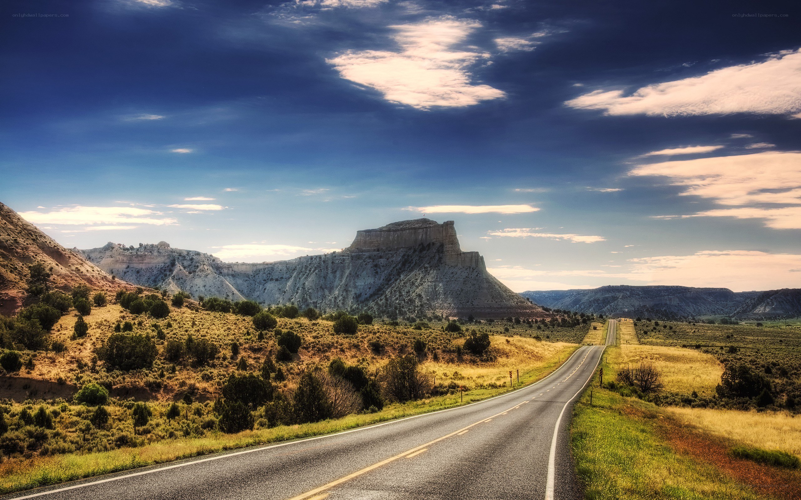 Desert road with rock formation