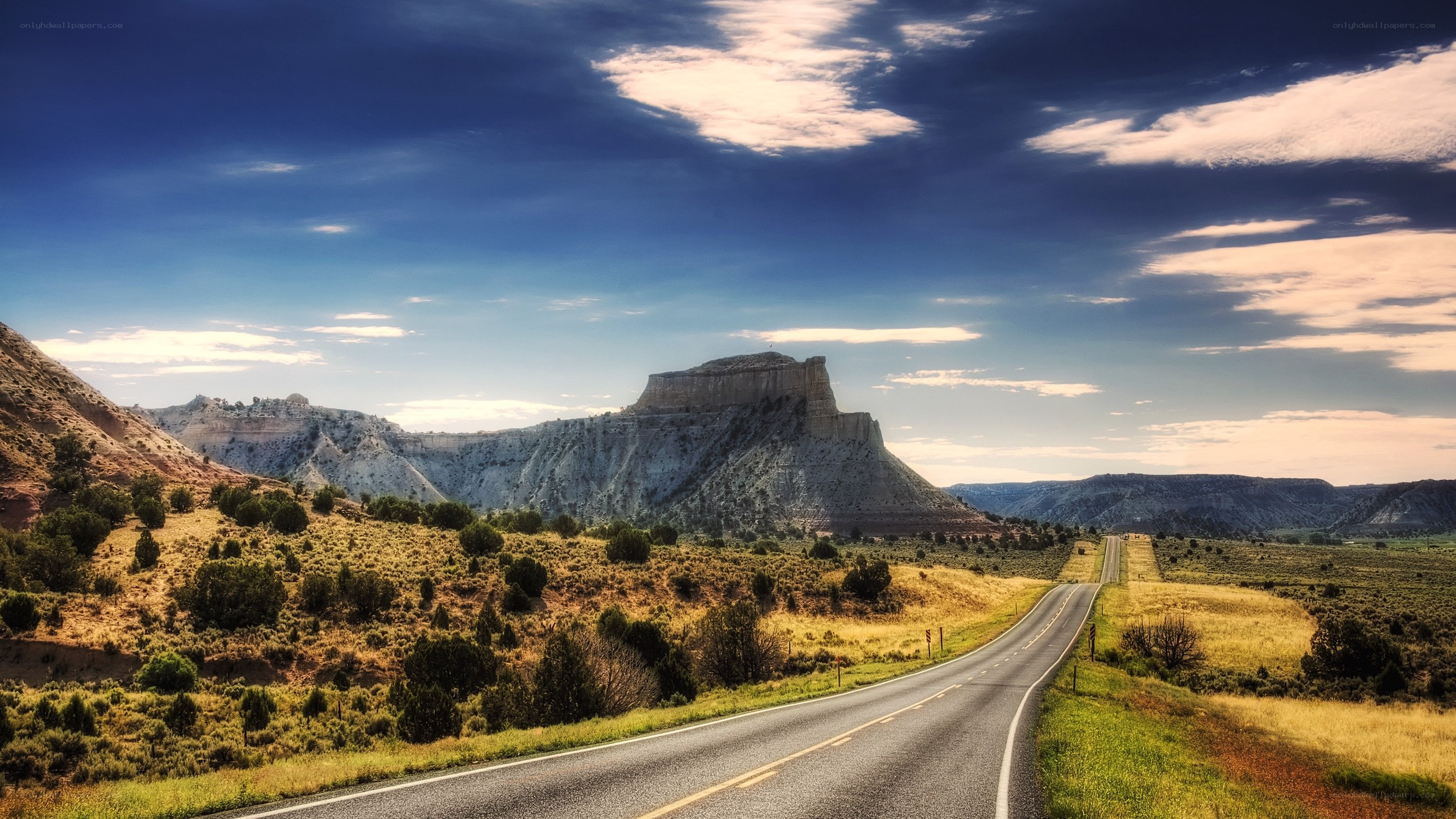 Desert road with rock formation