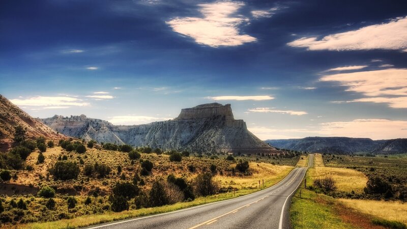 Desert road with rock formation