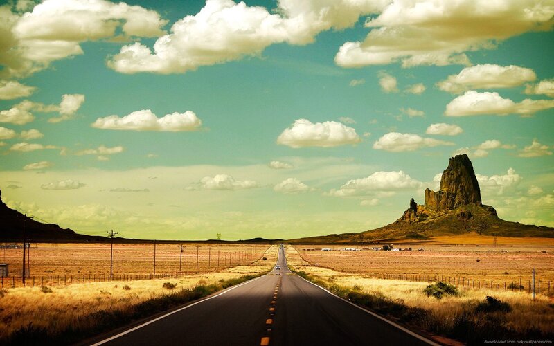 Desert road with rock formation