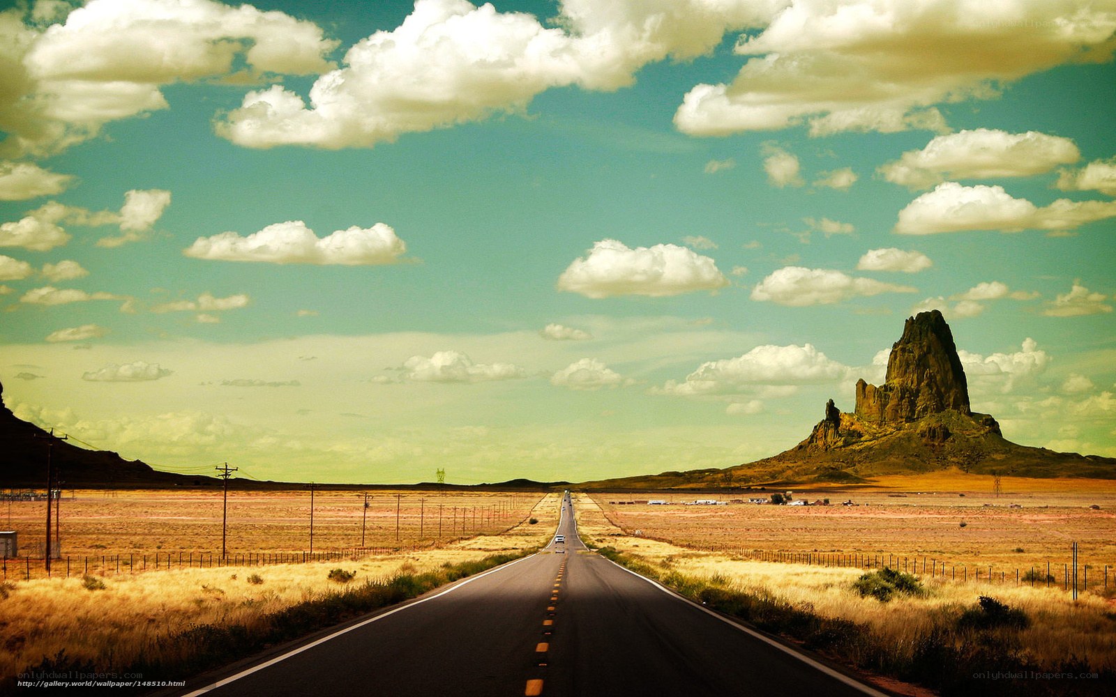 Desert road with rock formation