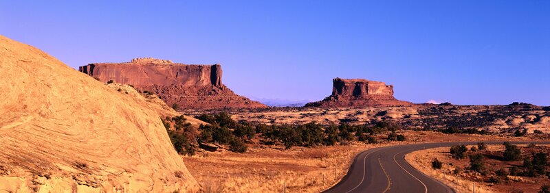 Desert road with rock formations