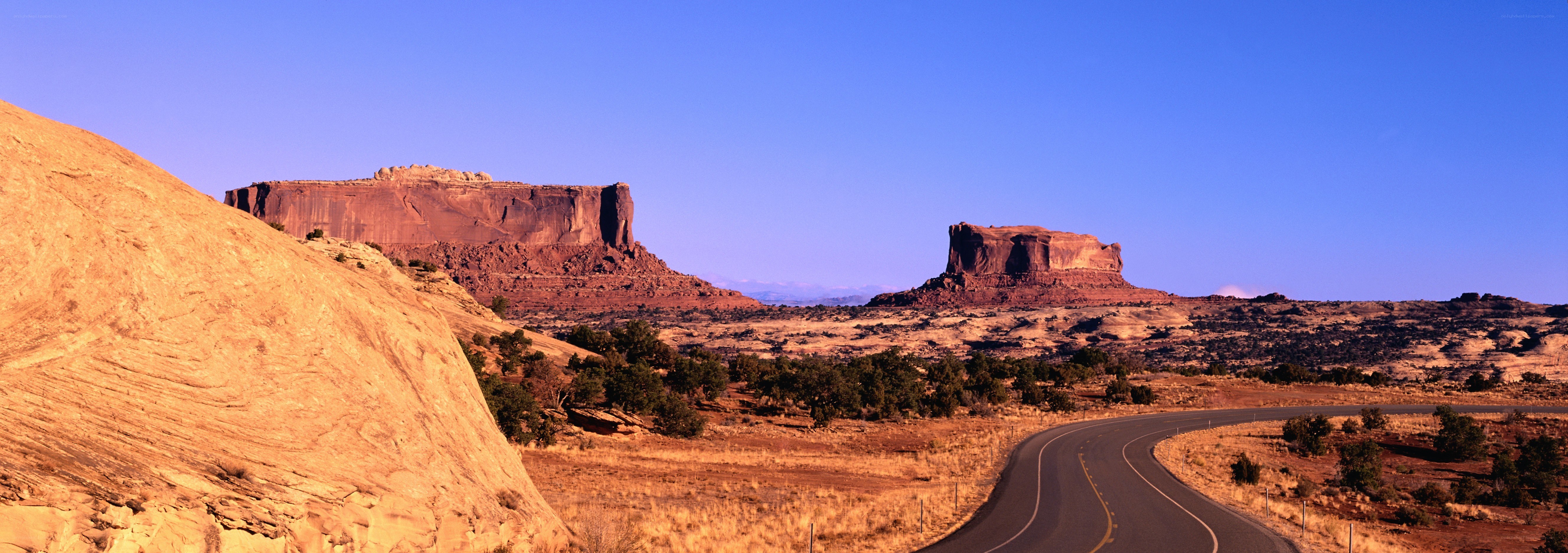 Desert road with rock formations