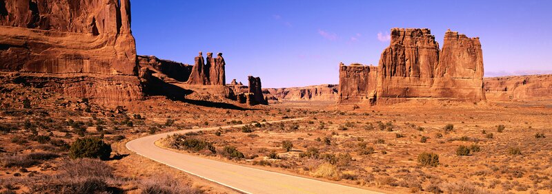 Desert road with rock formations