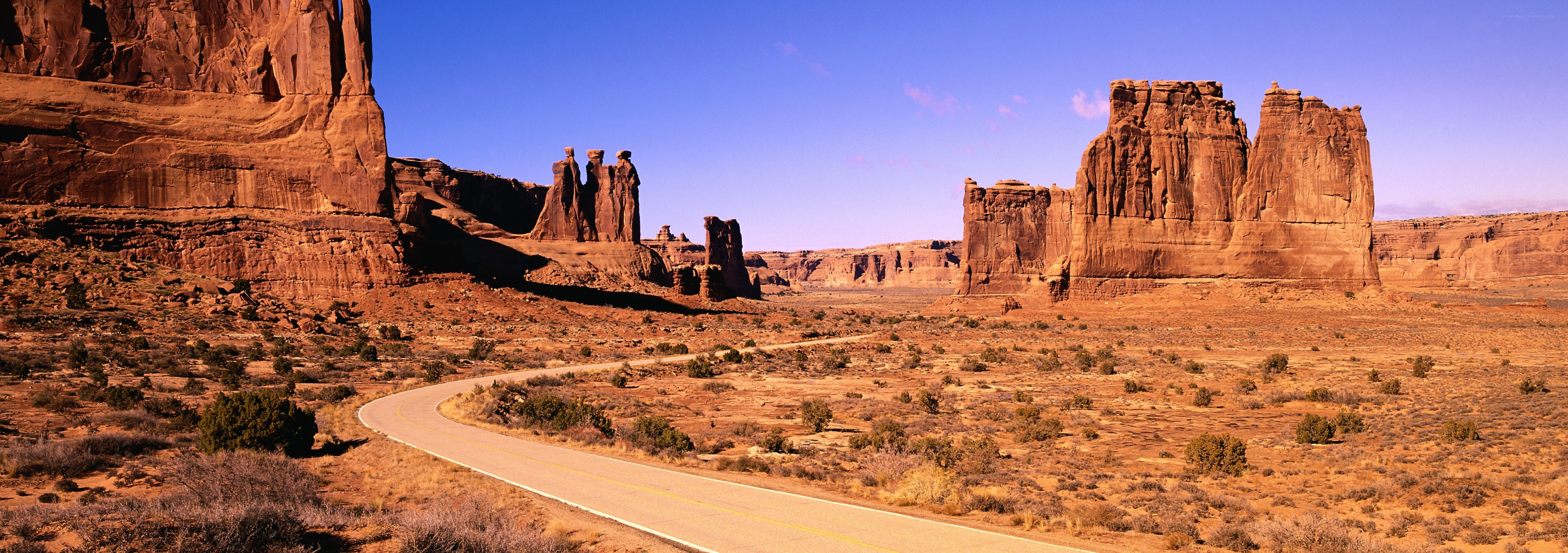 Desert road with rock formations