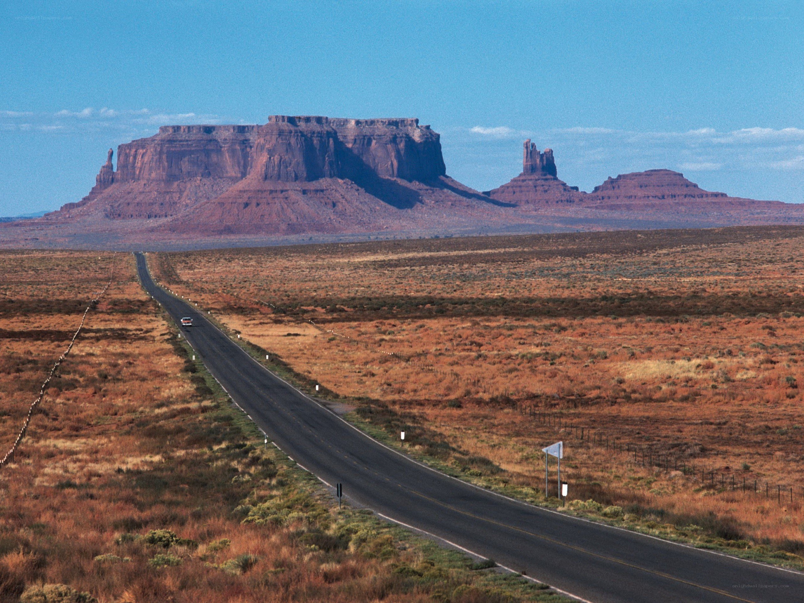 Desert road with rock formations