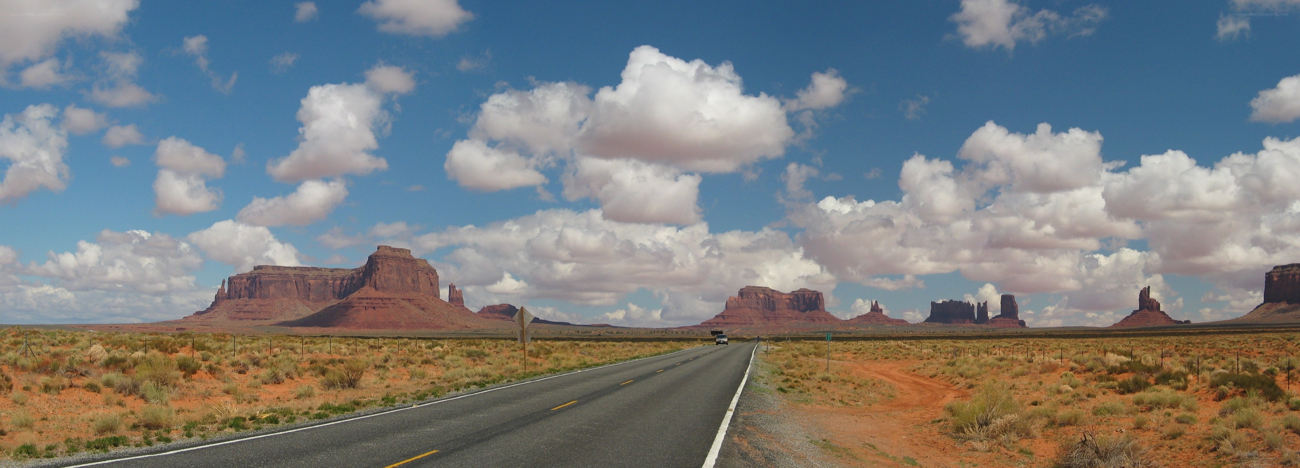 Desert road with rock formations