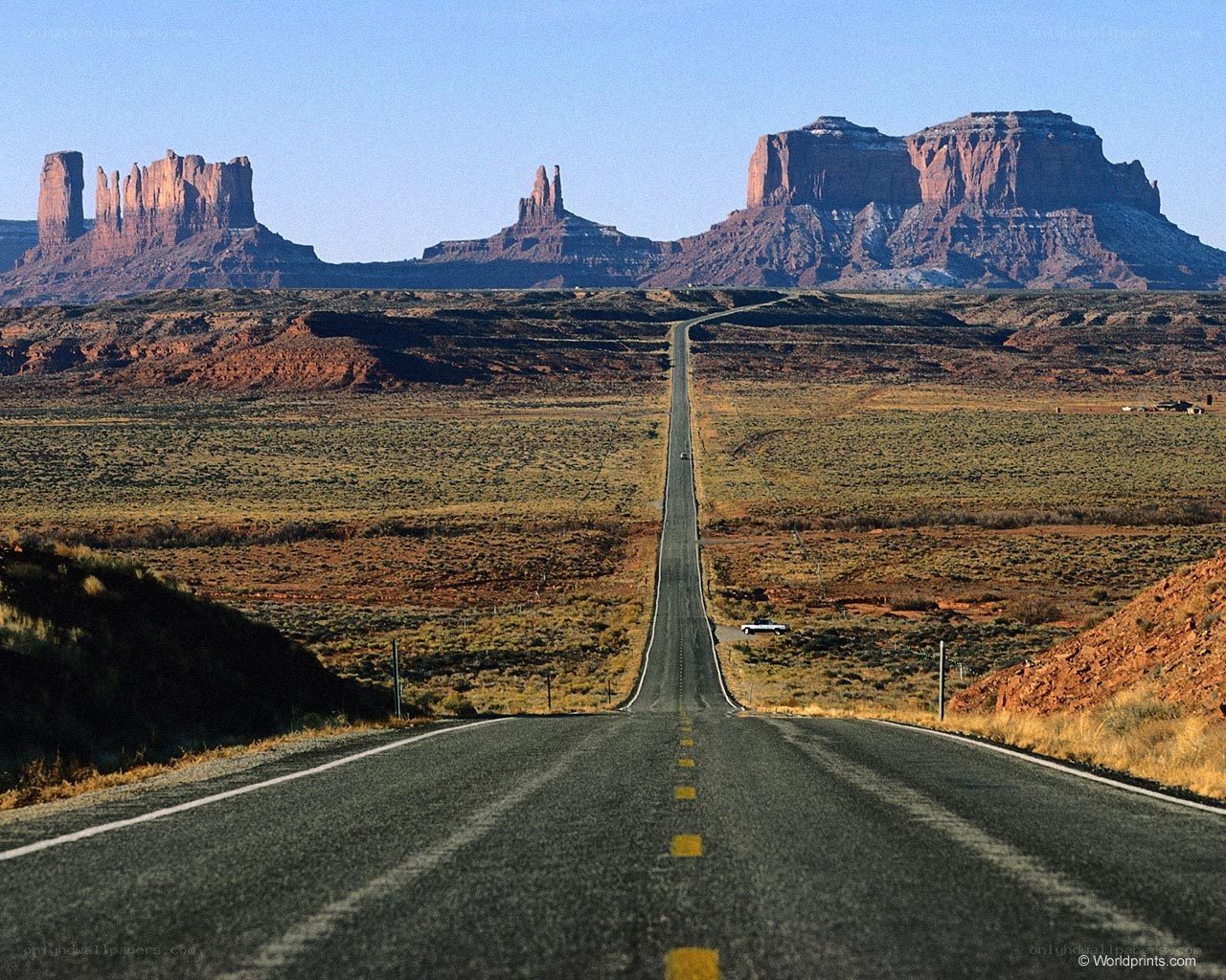 Desert road with rock formations