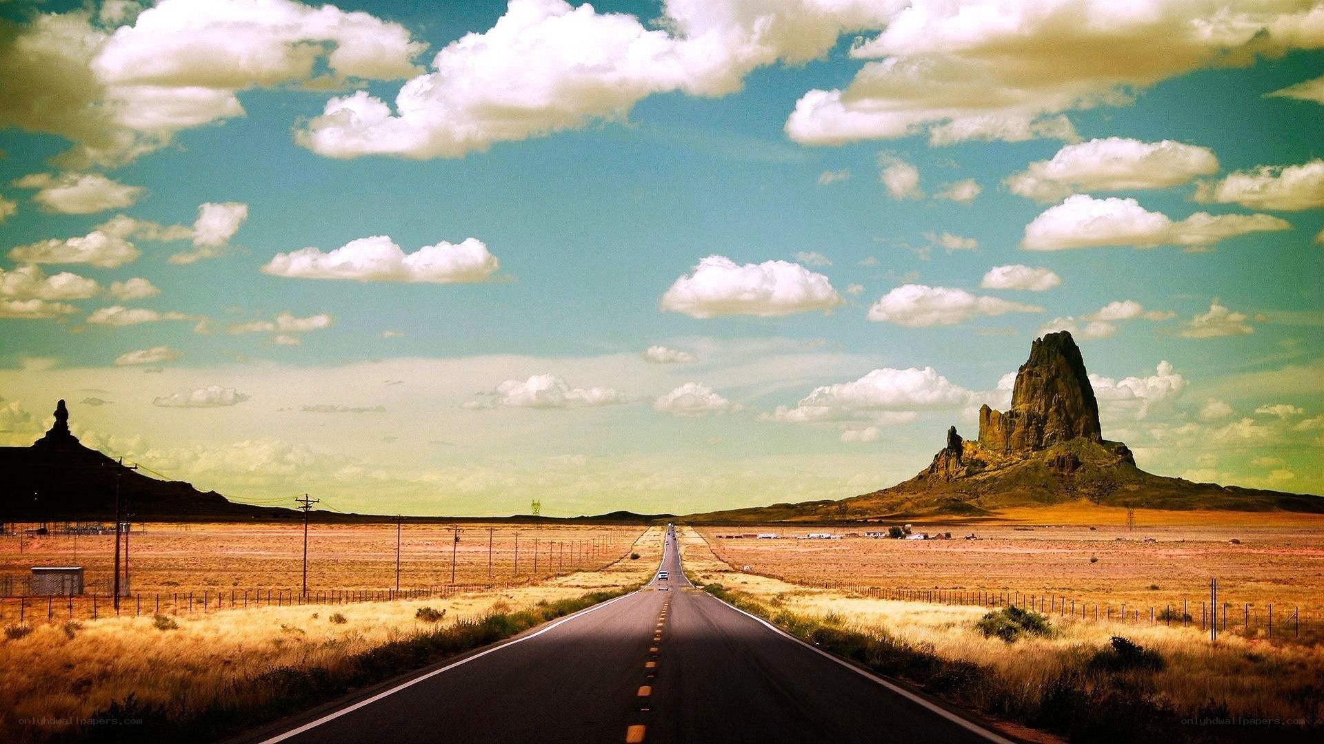 Desert road with rock formations