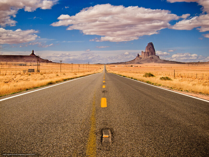 Desert road with rock formations
