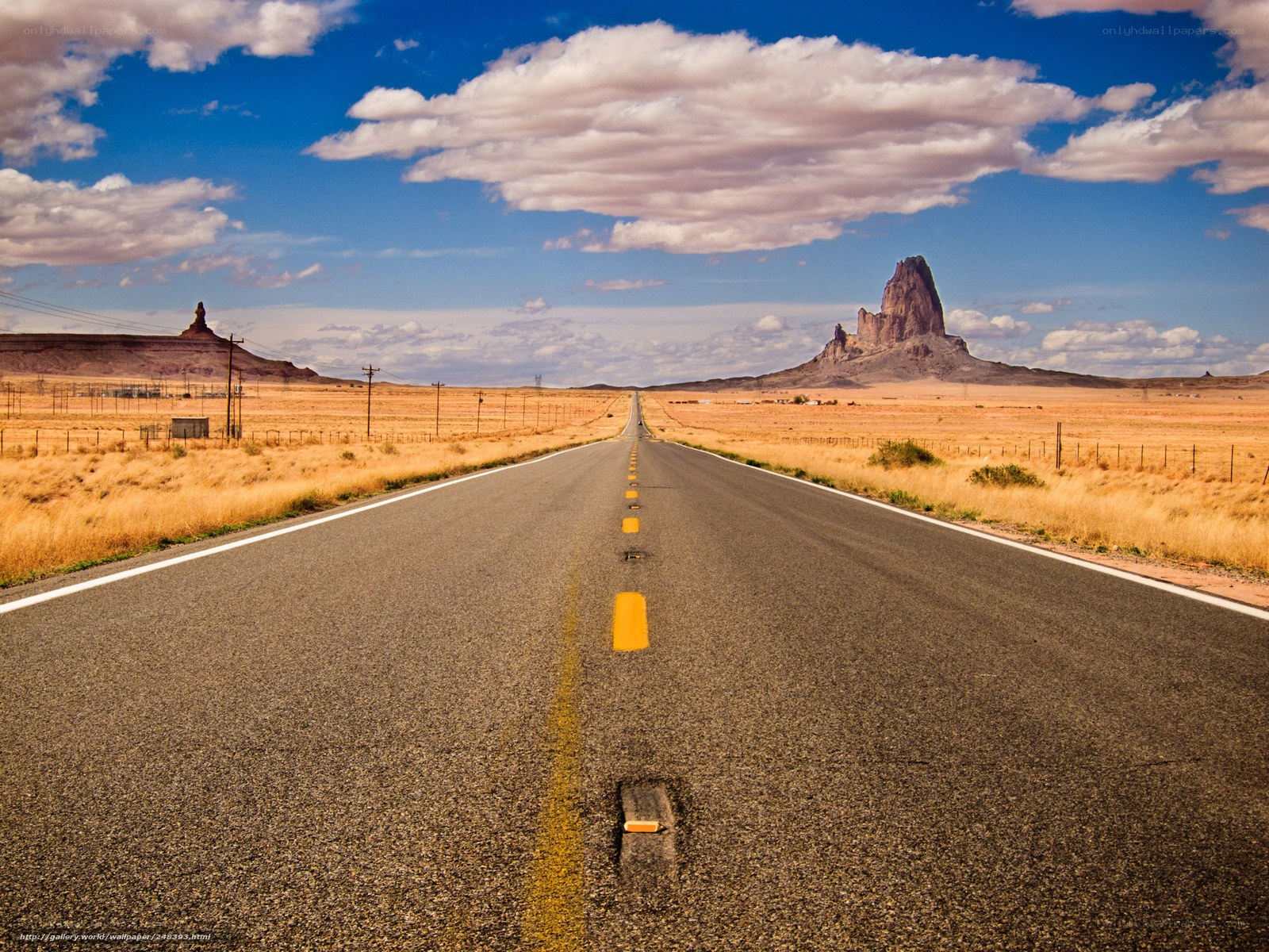 Desert road with rock formations
