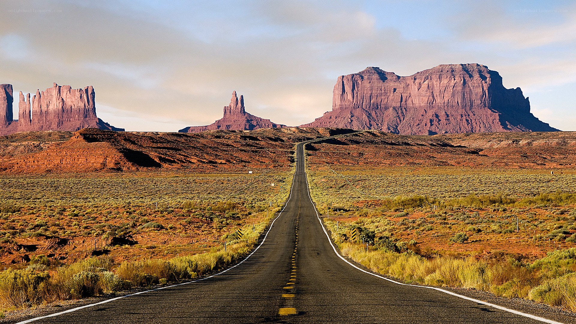 Desert road with rock formations