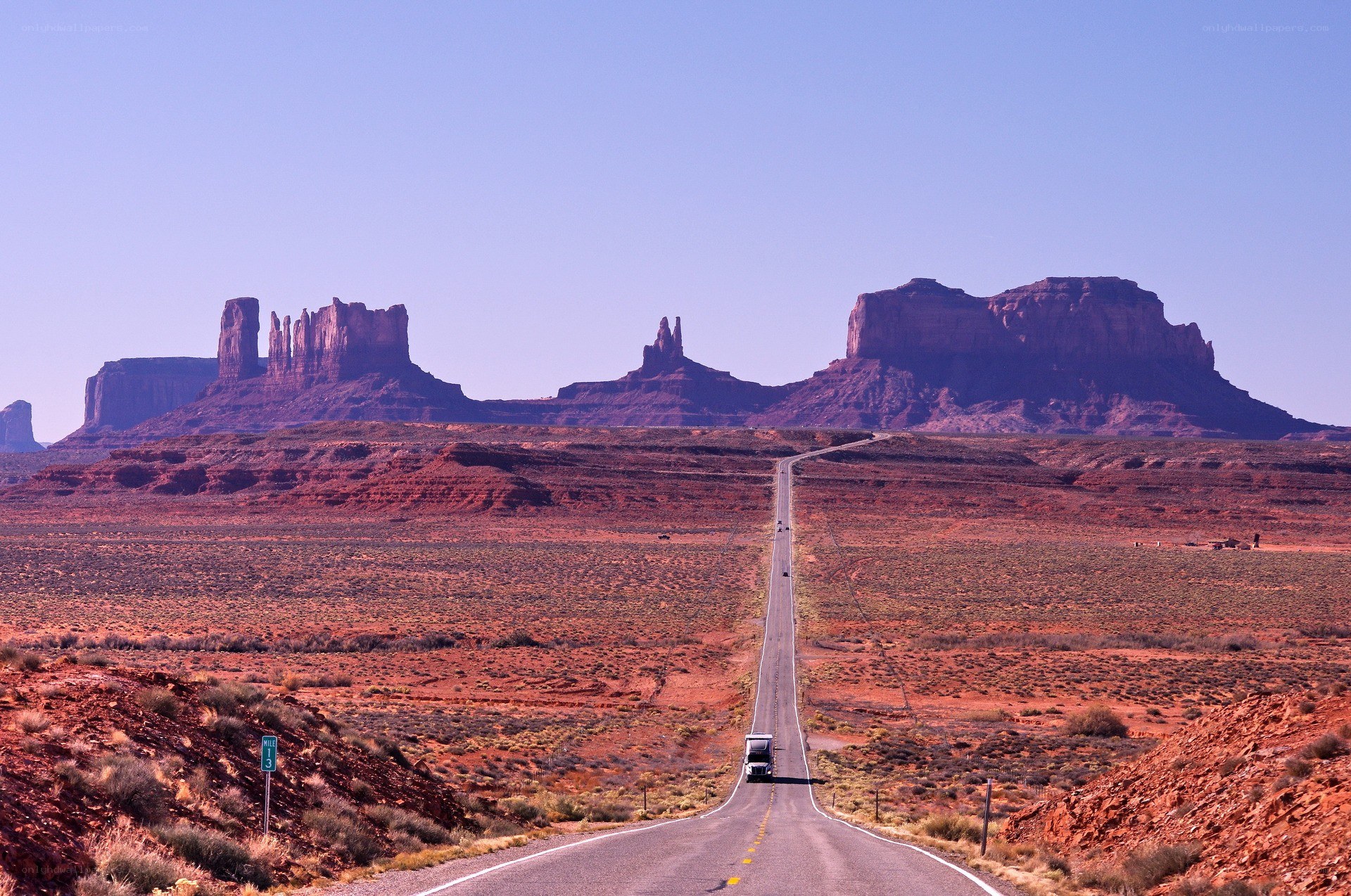 Desert road with rock formations