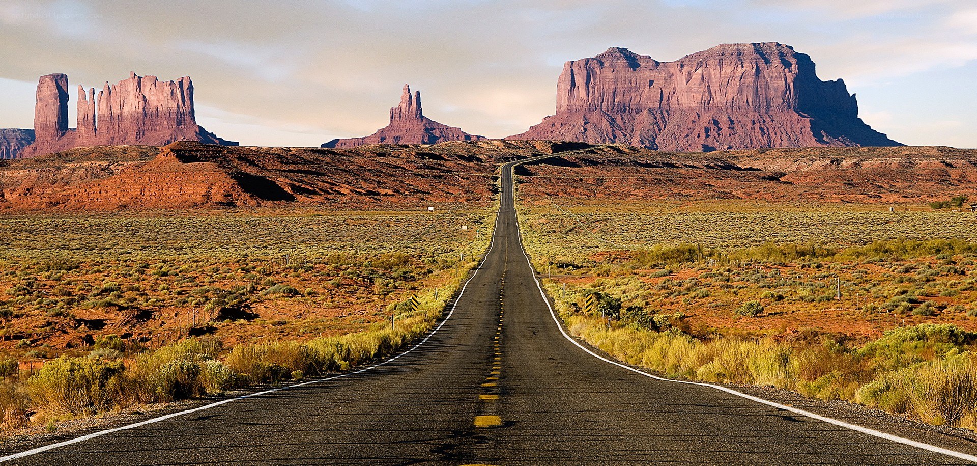 Desert road with rock formations