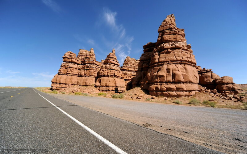 Desert road with rock formations