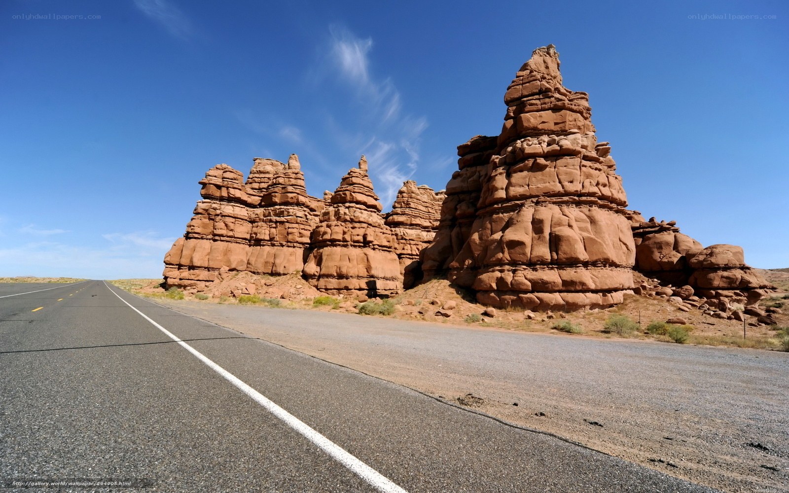 Desert road with rock formations