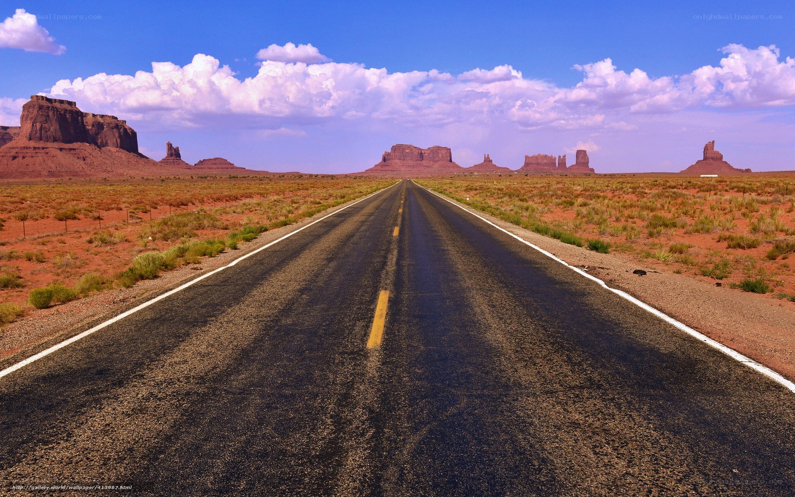 Desert road with rock formations