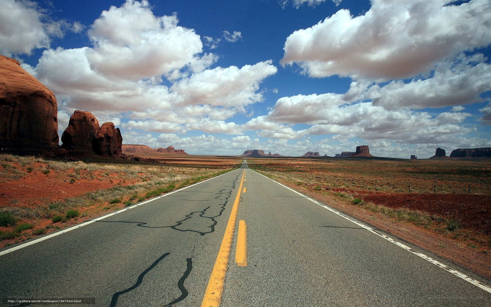 Desert road with rock formations