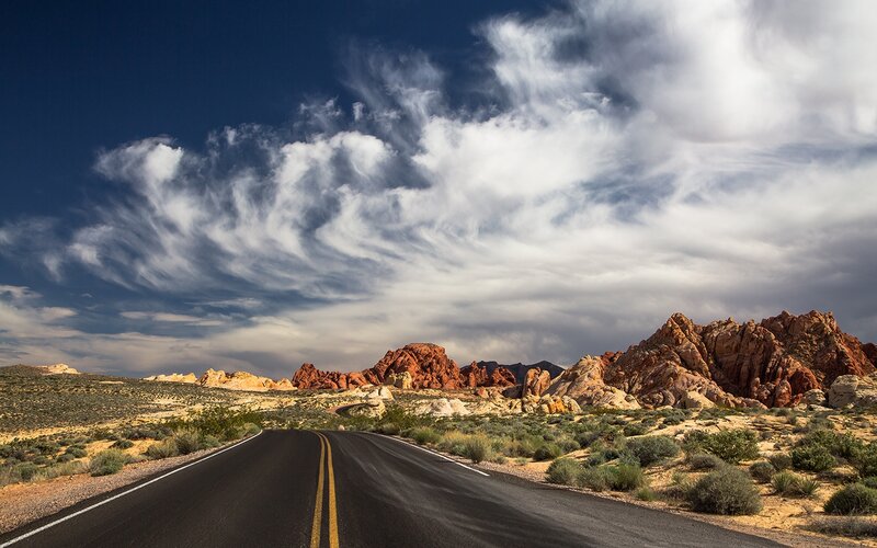 Desert Road with Rock Formations — Blue, Dramatic, Afternoon
