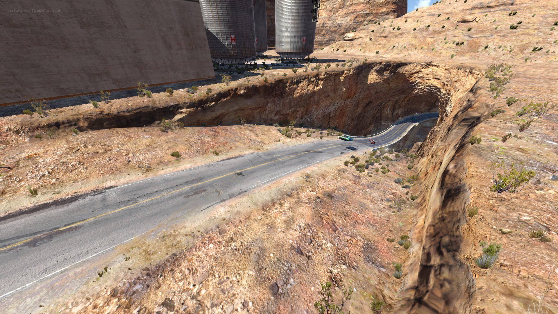 Desert road with silos