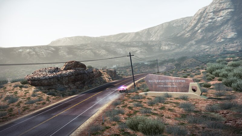 Desert road with visitor center sign
