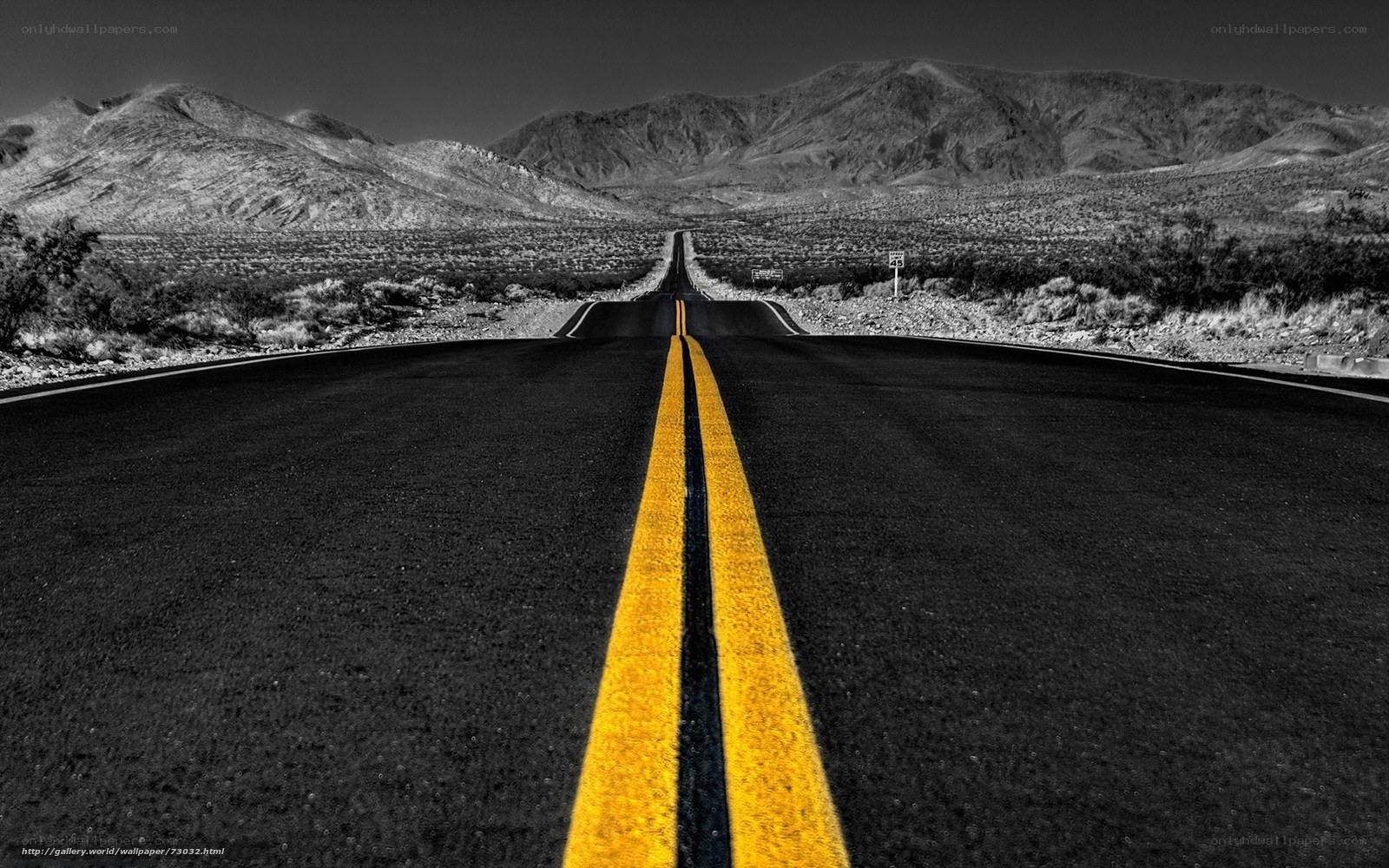 Desert road with yellow lines