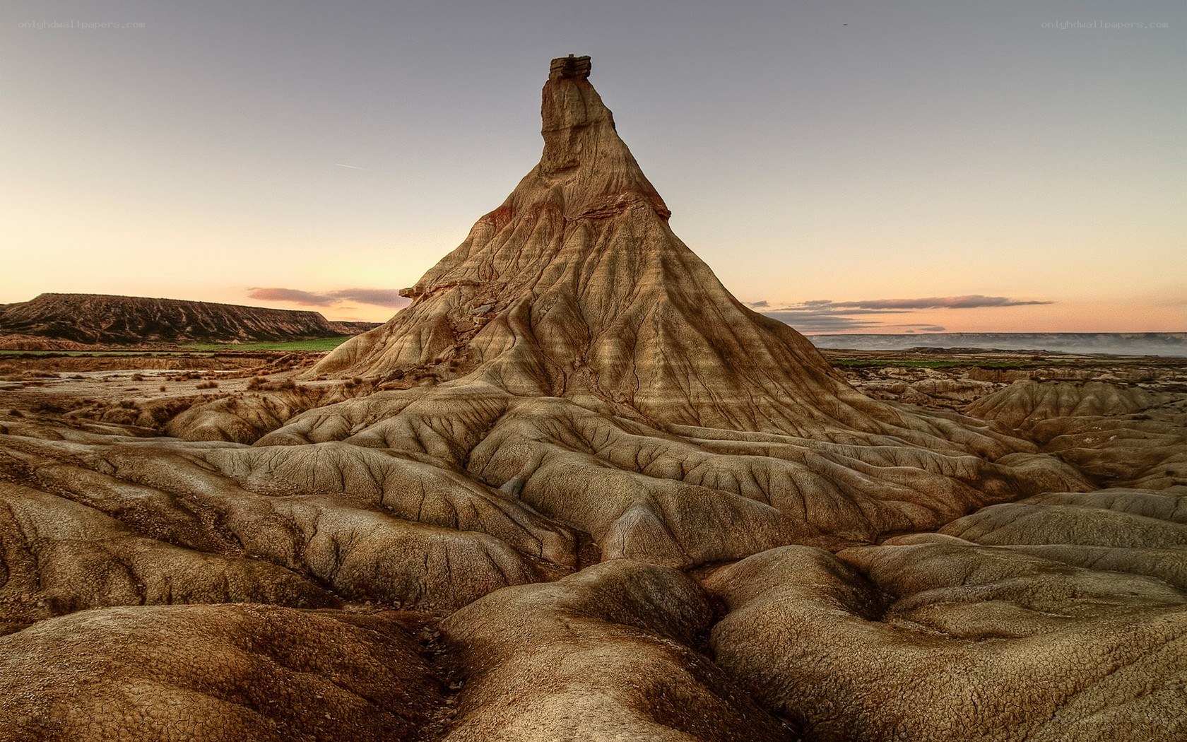 Desert rock formation at sunset