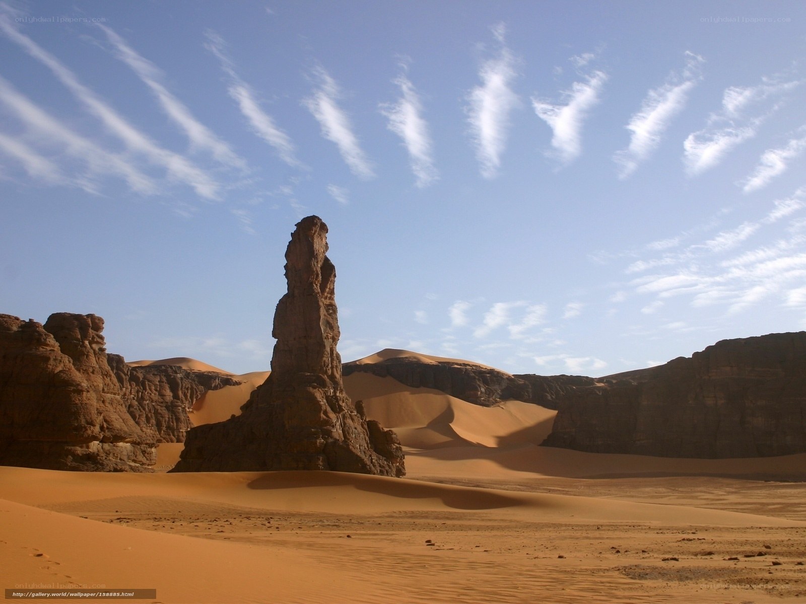 Desert rock formation under blue sky
